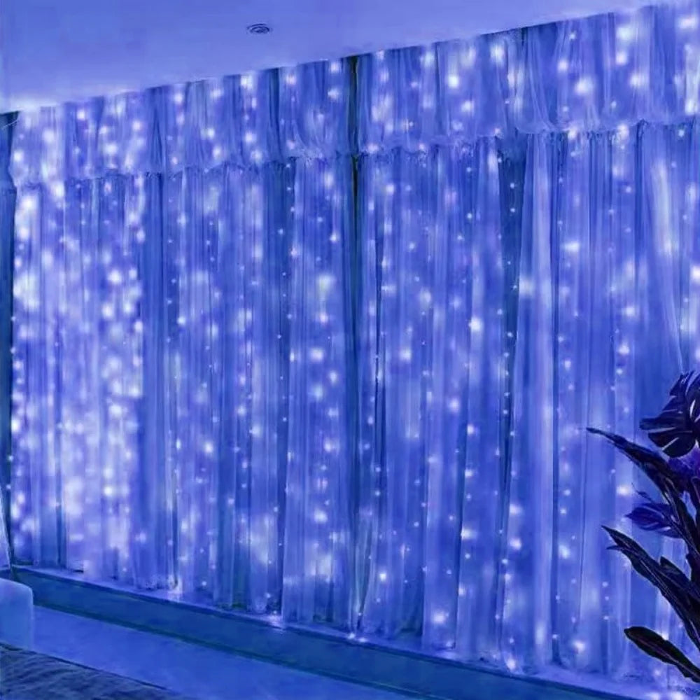 Blue LED curtain string lights with twinkling fairy lights illuminating a window or backdrop.