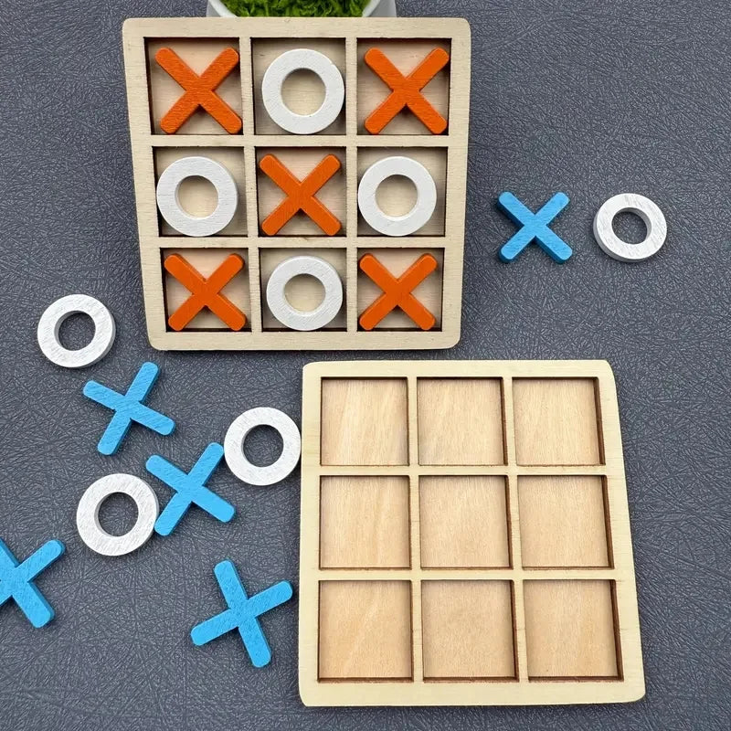 A wooden tic tac toe game set featuring orange and white wooden pieces on a dark gray surface.