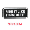 Black embroidered iron-on letter patch with white text that reads Ride it like you stole it