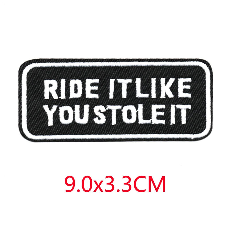 Black embroidered iron-on letter patch with white text that reads Ride it like you stole it