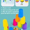 A hand is stacking colorful plastic cups of various sizes and colors, along with an activity card, for a learning game.