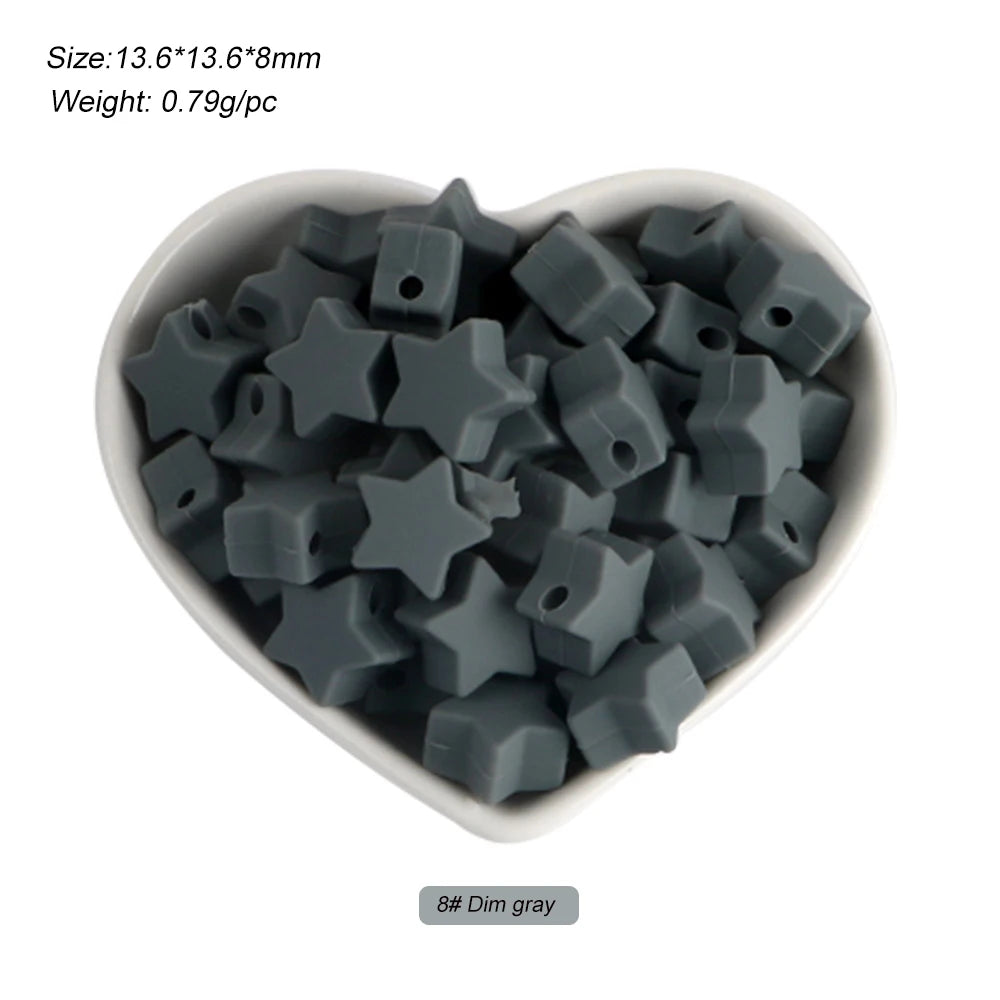 A pile of dim gray silicone crown star heart beads for DIY jewelry making