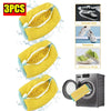 Three yellow reusable shoe laundry bags with bristled brushes shown next to a washing machine.