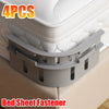 Four gray bed sheet fastener clips are shown securing a mattress cover or sheet.