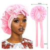 Pink silky satin sleep cap with wide band shown on a model and separately, measuring 30cm.