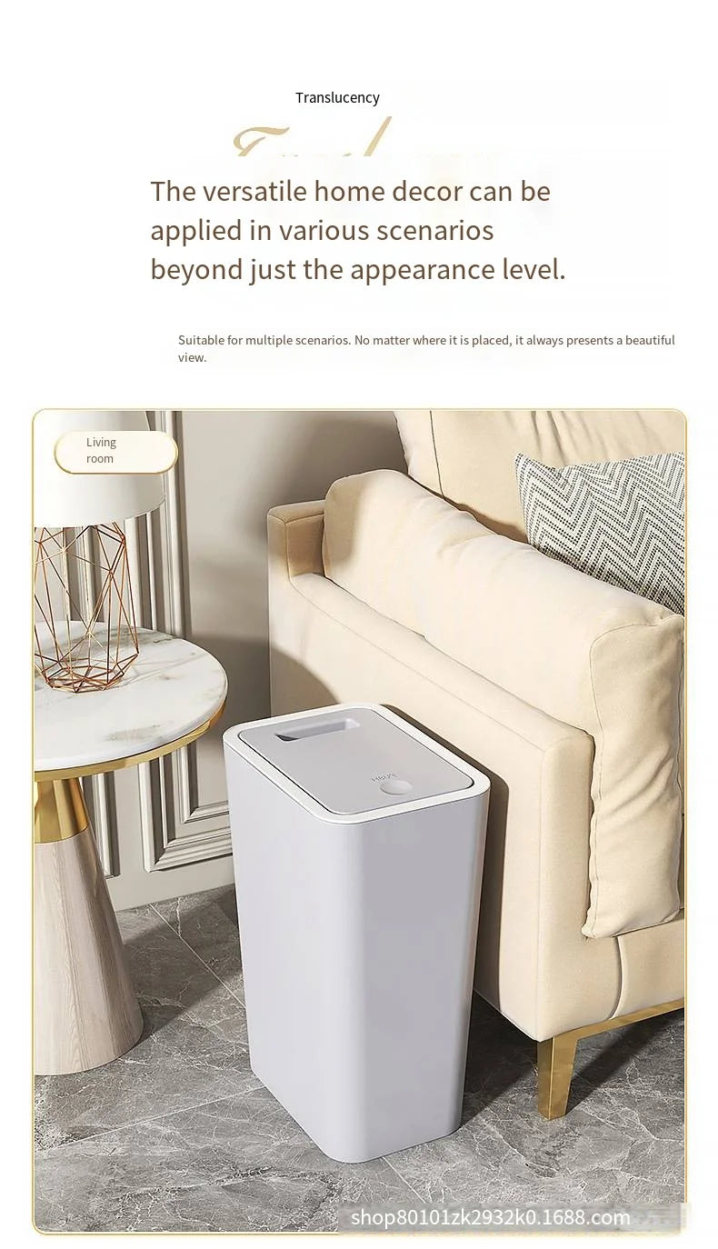A white pop-up slim trash can is shown next to a sofa in a living room setting.
