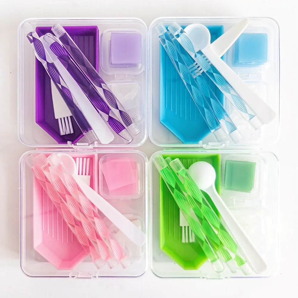 A set of diamond painting accessories including various tools and beads stored in colorful plastic compartments.
