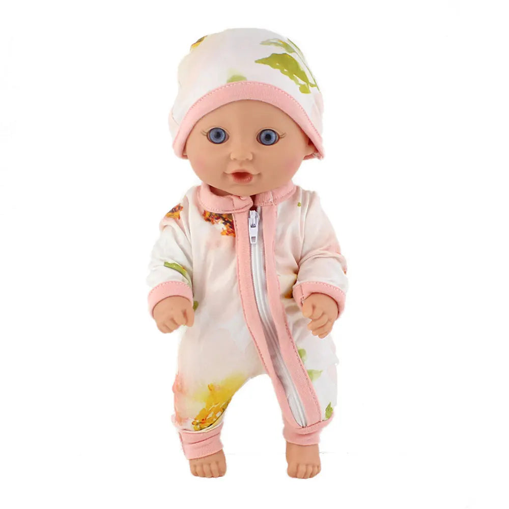 A baby doll wearing a pink jumpsuit outfit with a green map design on the hood
