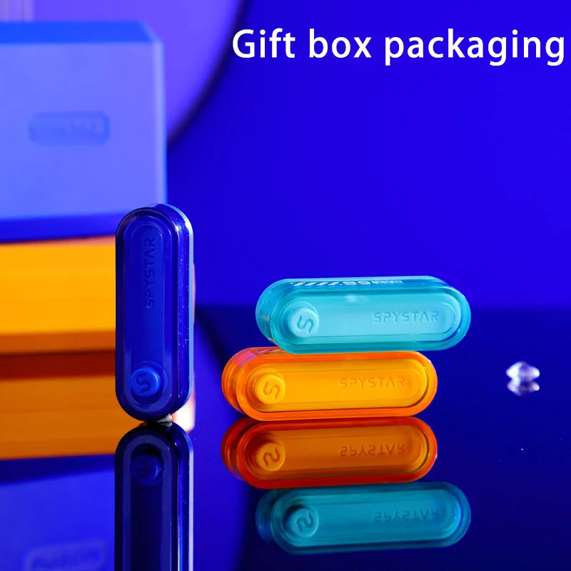 A collection of colorful metal fidget sliders in various shades of blue, orange, and teal displayed on a dark surface.