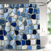 Abstract geometric black and white shower curtain featuring various blue and white irregular stone shapes.