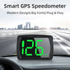 A digital smart GPS speedometer with a large green LED display mounted in a car's dashboard.