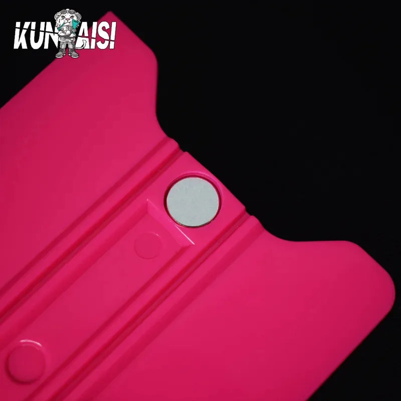 A close-up view of a pink magnetic suede edge squeegee tool for vinyl wrap and window tinting.