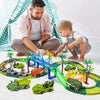 A boy is playing with a dinosaur adventure climbing race track toy set featuring various vehicles and jungle scenery.