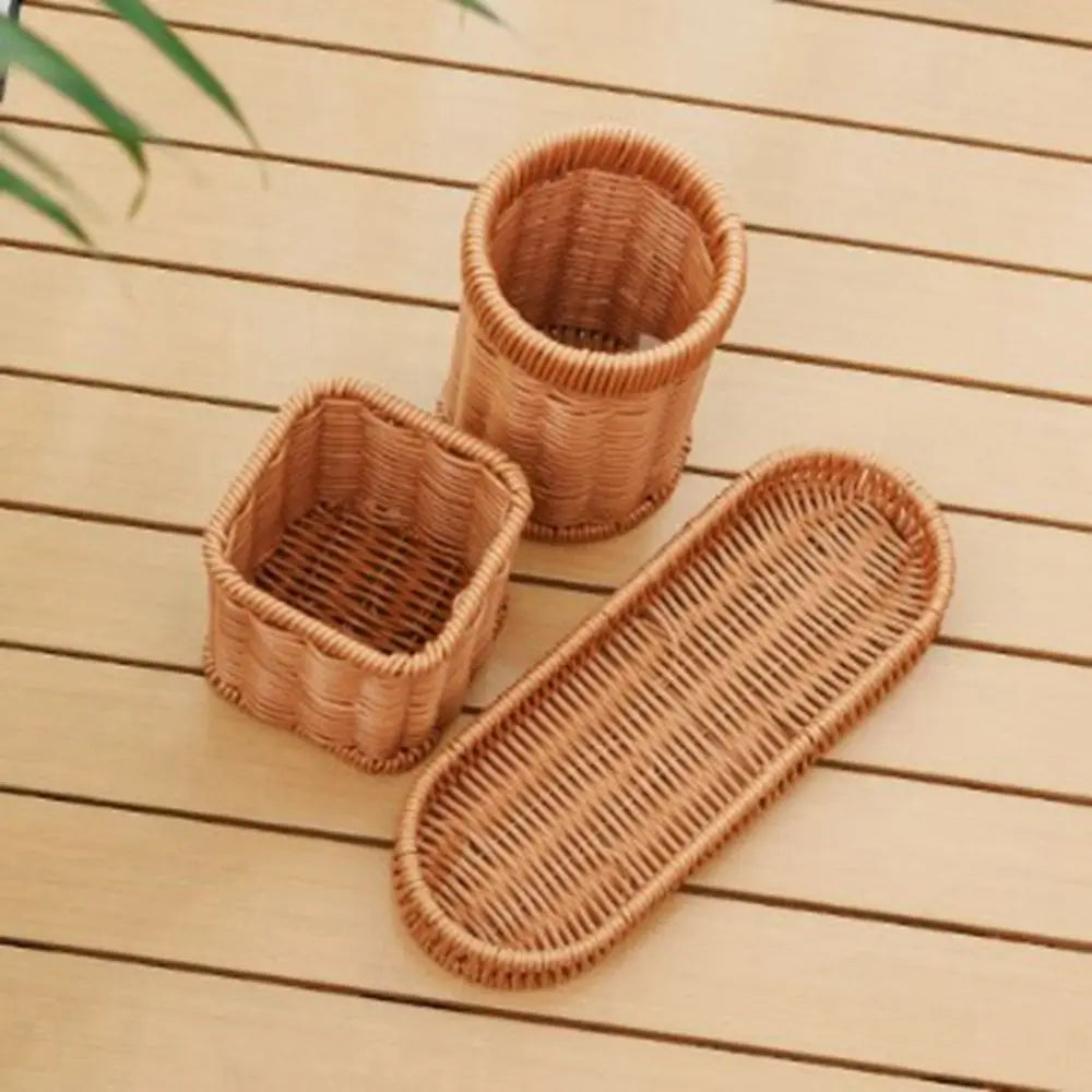 A set of seven handwoven natural wicker serving baskets resting on a light wooden surface.
