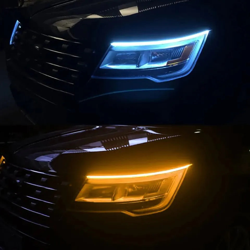 Close-up of a car's headlight featuring bright blue LED daytime running lights.