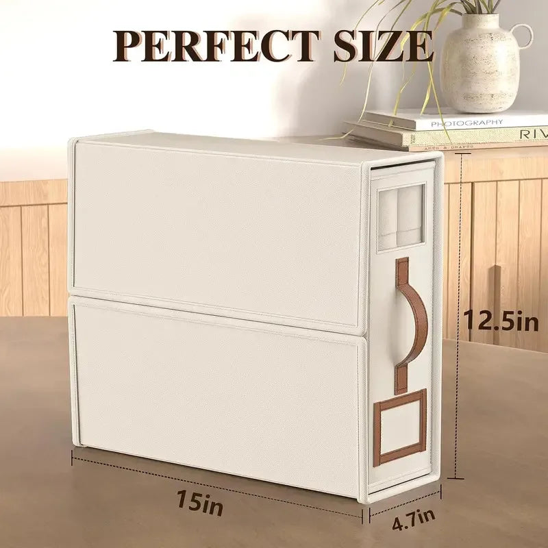 A white foldable bedding storage box with a clear window is shown on a wooden surface.