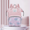 A pink bear print waterproof diaper backpack displayed on a white stand.