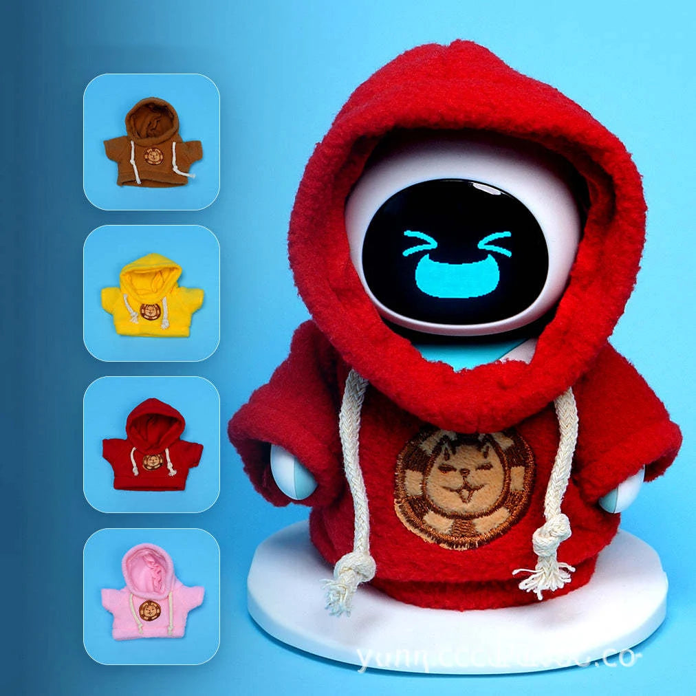 A plush robot figure wearing a red hooded outfit with gold embroidery and white strings.