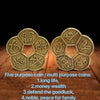 Five purpose coins made of brass with traditional Chinese characters for luck and wealth