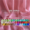 A swatch chart of various colors of silk chiffon fabric showing transparency and flowy drape.
