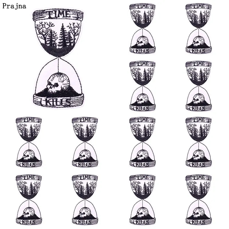 A collection of ten embroidered iron-on patches featuring rock skulls for clothing and accessories.