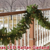 Christmas LED Rattan Garland Type C decoration draped along a wooden railing in an outdoor setting.