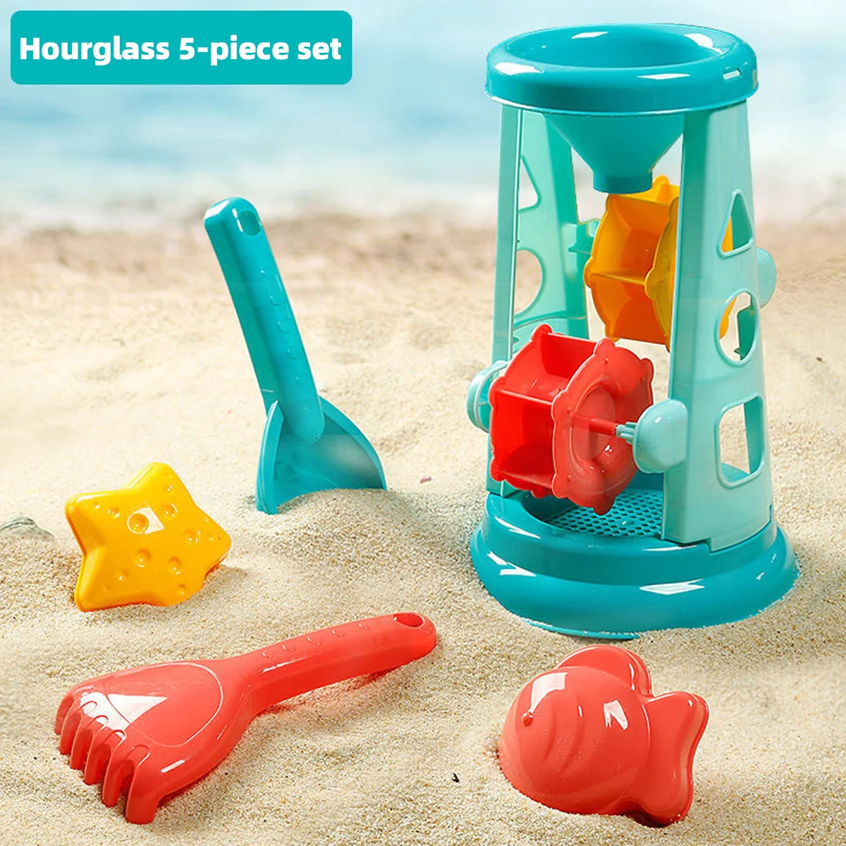 A turquoise hourglass set with various colored sand tools like a shovel, scoop, and spoon resting on light sand.