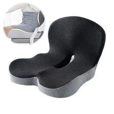 A black ergonomic memory foam car seat cushion with lumbar support shown in a close-up view.