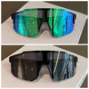 A pair of black sunglasses with a reflective, multi-colored pattern resting on a white surface.