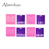 A set of pink silicone resin molds featuring various text and designs on purple glitter backgrounds for badge backings and ke