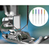 A close-up of three anti-jump sewing machine needles in various colors, shown next to a sewing machine tool.