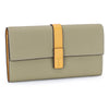 A light olive green women's cowhide leather bifold wallet with a tan strap and card slots.