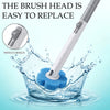 A close-up view of a white brush head being replaced on a toilet brush, demonstrating an easy switch design.