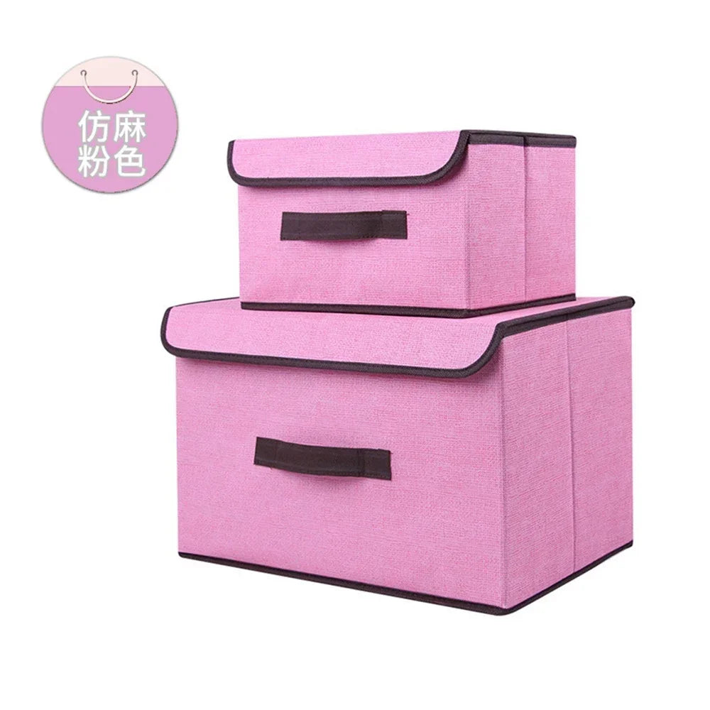 A set of two pink fabric storage boxes for closet and drawer organization.