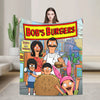 A colorful cartoon featuring characters from Bob's Burgers, including a woman and a man, on a throw blanket.