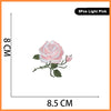 Five pink light embroidered rose patches shown against a measurement scale.