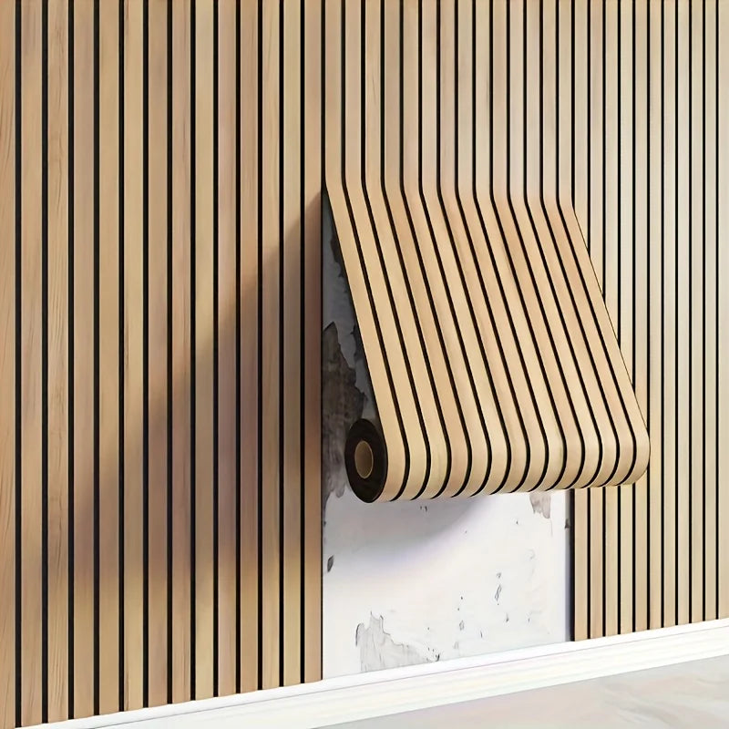 A close-up of wood grain peel-and-stick wall tiles installed vertically on a light-colored wall.