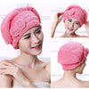 Pink microfibre quick-dry hair towel wrap with a bowknot shown on a woman's head and shoulder.