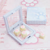 A white silicone keycap set featuring cat paw shapes and pink hearts displayed in an open case.
