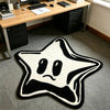 A black and white irregular pentagram rug with a simple, sad face design on a gray floor.