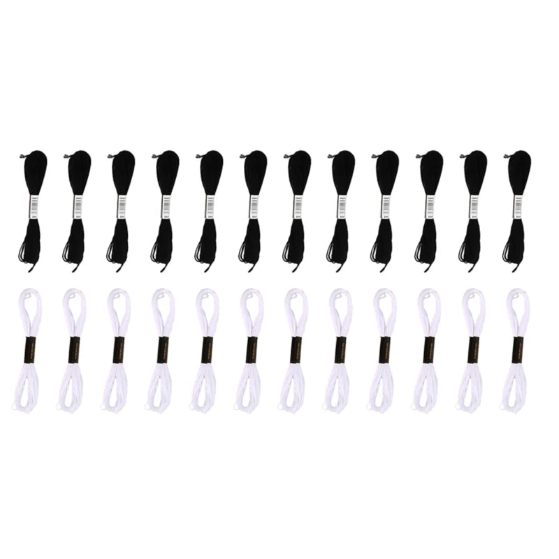 A set of 24 embroidery floss needles in white and black.