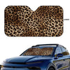 Leopard print car windshield sunshade applied to a blue car window.