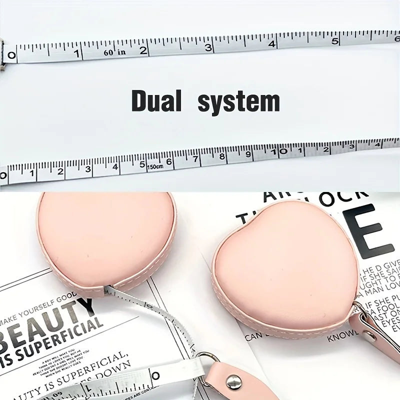 Pink PU leather tape measure shown next to a ruler, demonstrating dual system for body measurements.