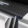 Close-up view of a carbon fiber leather door sill protector showing the textured surface and material thickness.
