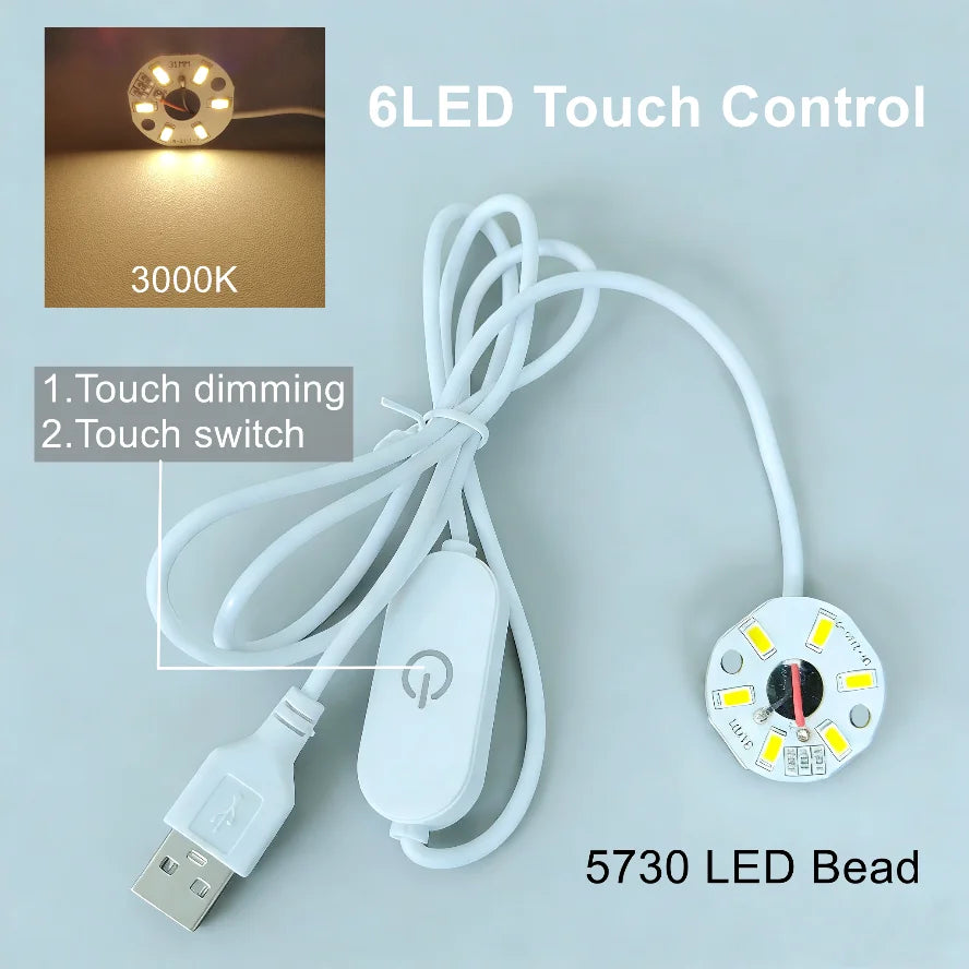 A white USB LED bead with a remote control for touch dimming and a separate LED light source.