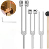 A set of three metal tuning forks (128Hz, 256Hz, 512Hz) for sound healing displayed next to a woman's ear.