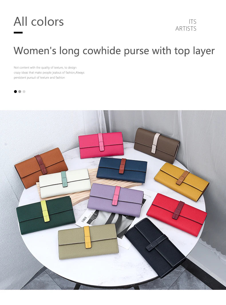 A collection of women's long cowhide leather purses in various colors and shades displayed on a white table.