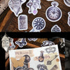 A collection of vintage alchemy washi stickers featuring decorative metal-embossed elements for journaling and scrapbooking