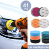 Car headlight restoration kit showing sanding discs, polishing pads, and a white foam block for restoration.