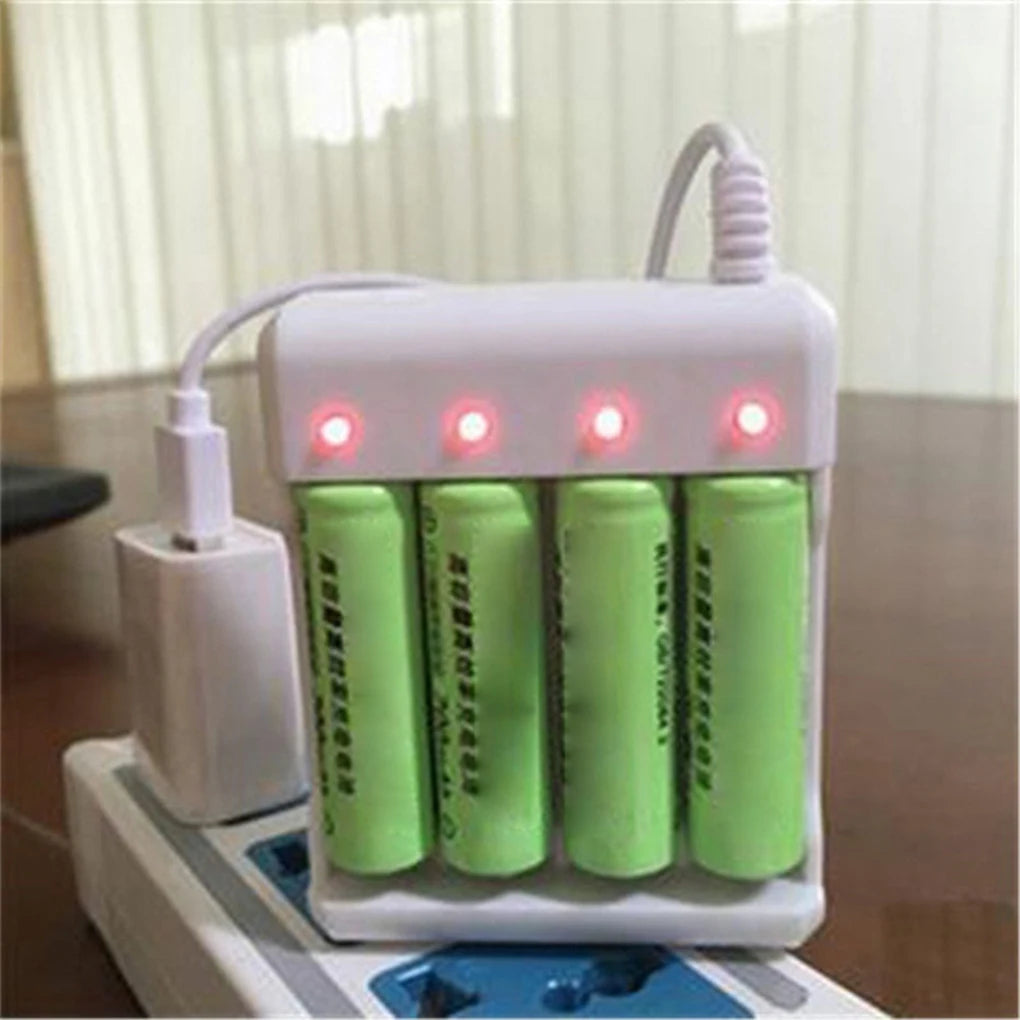 A white USB fast battery charger device with multiple slots for AA and AAA rechargeable batteries is shown on a wooden surfac